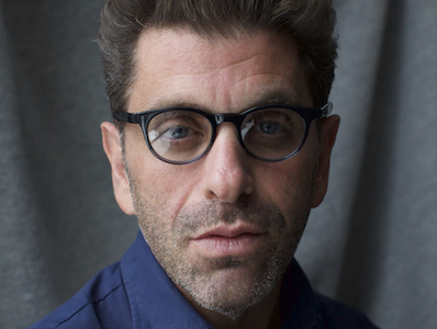 Eugene Jarecki, director of THE HOUSE I LIVE IN, and Evil Twin Booking speaker, in blue shirt and glasses